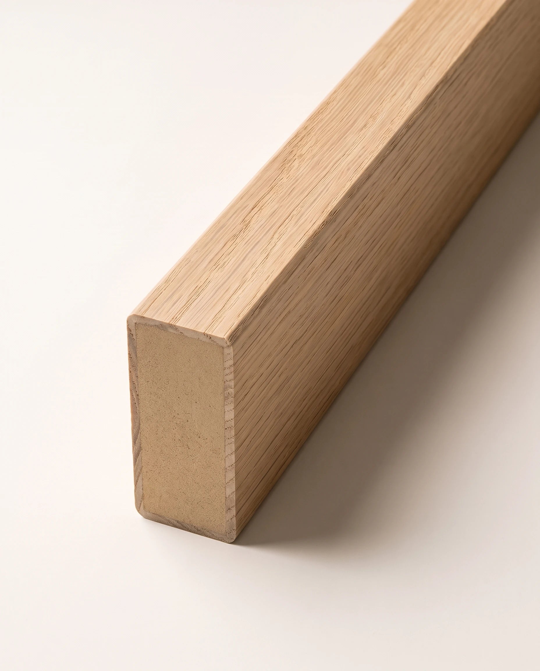 Close view of oak veneer around the engineered slat core