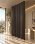 Oval slat room divider in dark grey stained oak, slats closed into a solid wall