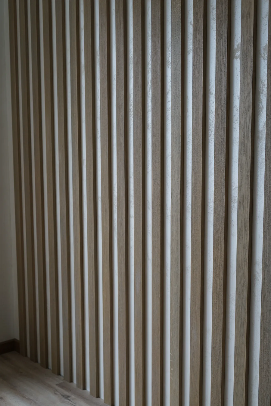 Partition, Slat Ceiling and Wall Panels in an Apartment
