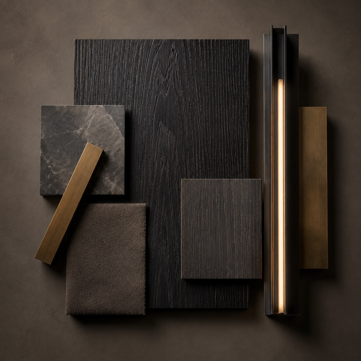 Blackened oak veneer material study showing visible open grain, graphite stone, dark Alcantara, brass and warm integrated light